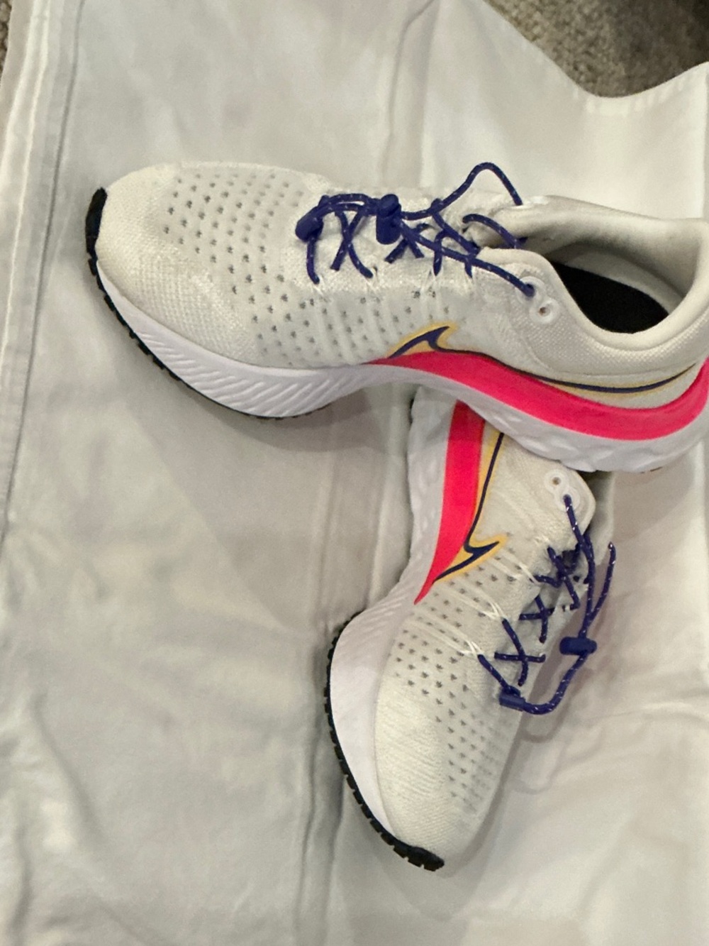 Nike White Running Shoes with Pink Accent and Purple Laces